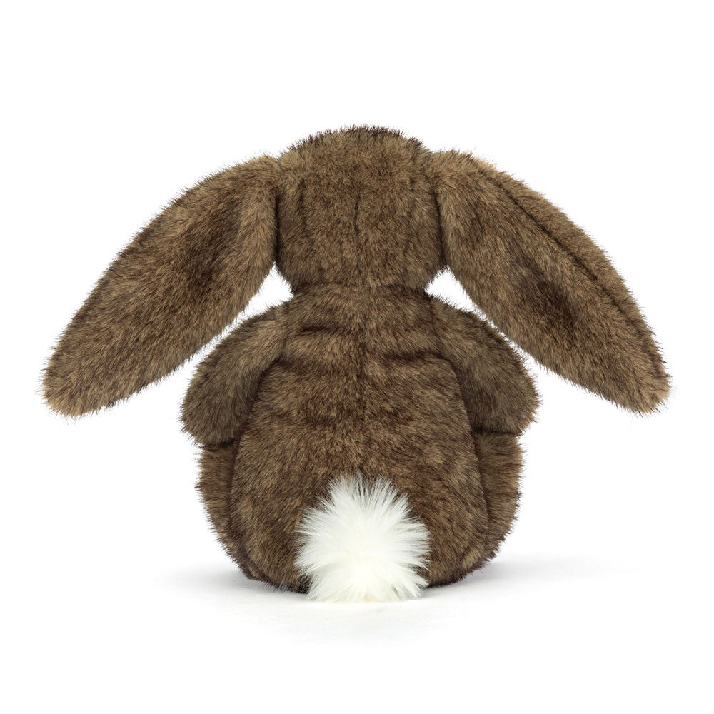 Vista lateral do Peluche Jellycat Hoppleston Luxe Bunny sentado com expressão elegante