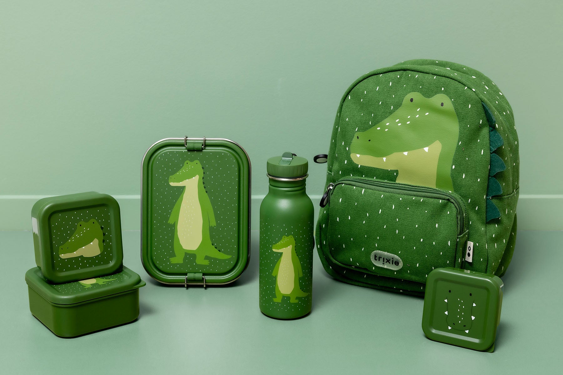Criança a usar a Mochila Jacaré Mr. Alligator Trixie Baby