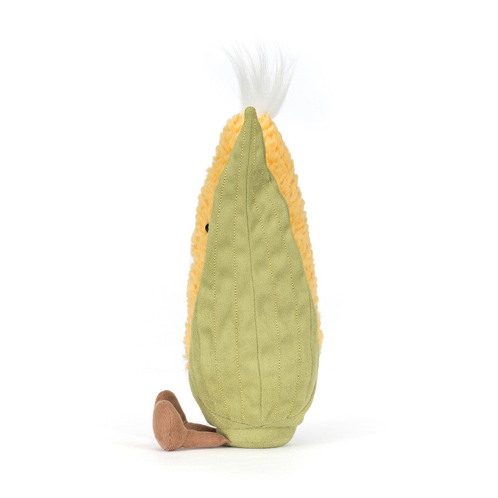 Vista lateral do Peluche Jellycat Amuseables Sweetcorn com folhas verdes e corpo amarelo