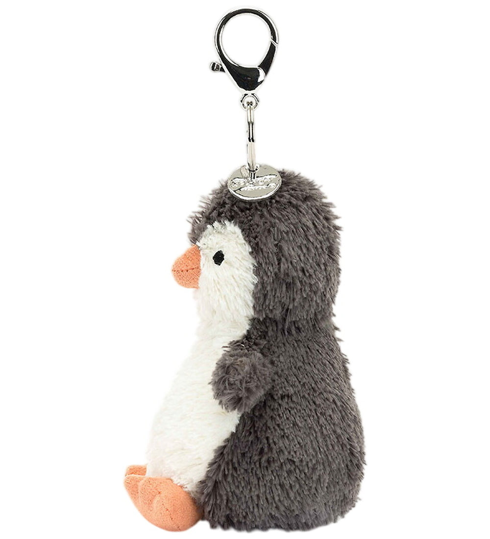 Porta-chaves pinguim Jellycat Peanut visto de lado, com bico e patas cor de laranja | jellycat-porta-chaves-pinguim-lollakids