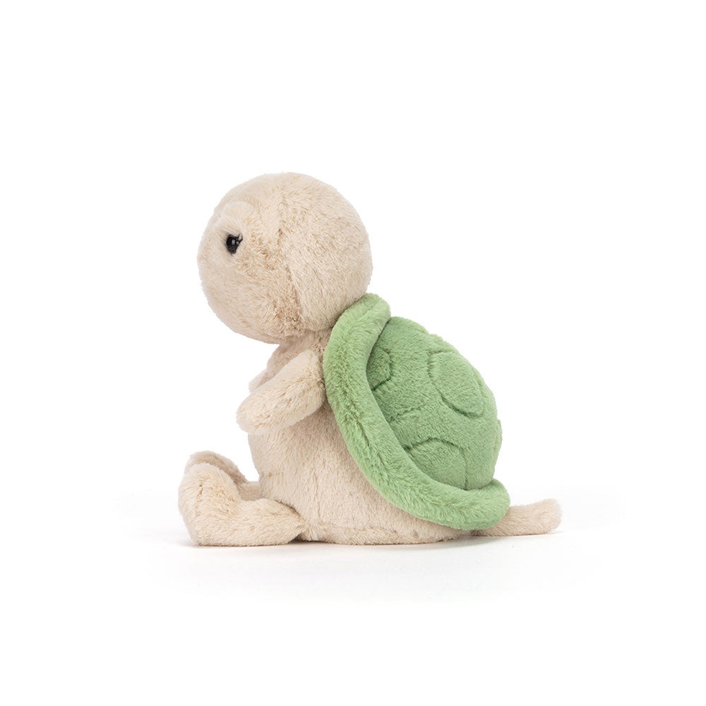 Vista lateral doPeluche Jellycat Thimble Turtle sentado com carapaça verde