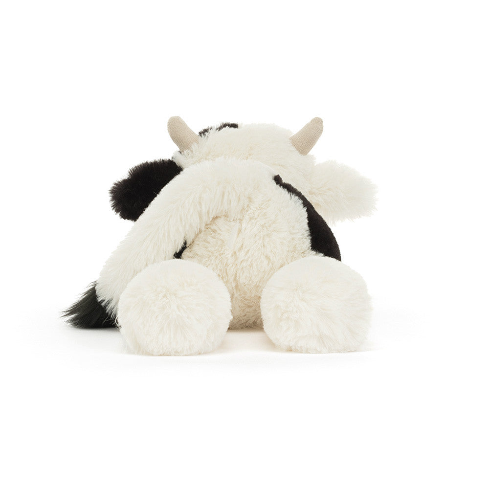 Vista de trás do Peluche Jellycat Smudge Cow deitado com pelo macio